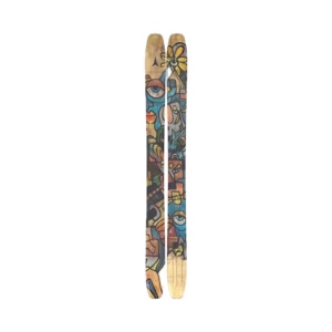 A pair of skis with colorful, abstract, graffiti-style artwork featuring eyes, faces, and geometric shapes on a light wood background. The skis are placed side by side on a plain white surface.