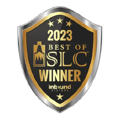 A gold and black shield-shaped badge reads 2023 Best of SLC Winner, inbound systems, with three stars at the top and a city skyline silhouette on the left side.