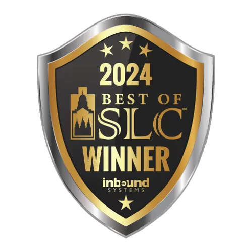 A gold and black shield-shaped badge reads 2024 Best of SLC Winner, inbound systems with stars and a stylized cityscape.