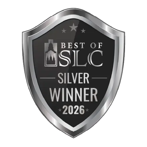 A silver and black shield-shaped badge reads Best of SLC Silver Winner 2026 with a small city skyline graphic and stars at the top.